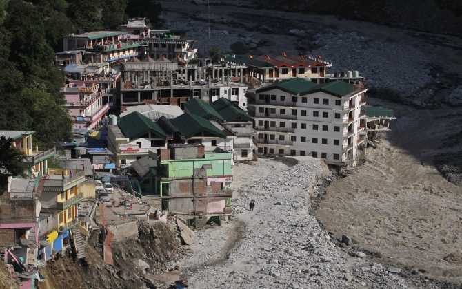 Buildings destroyed during floods are seen next to the Alaknanda river in Govindghat in Uttarakhand in this photograph taken on June 22, 2013.