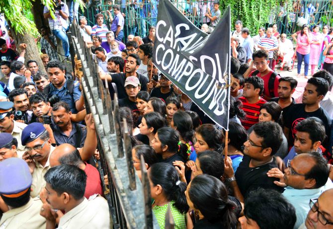 Residents of Campa Cola society form a human barricade not allowing the officials to enter