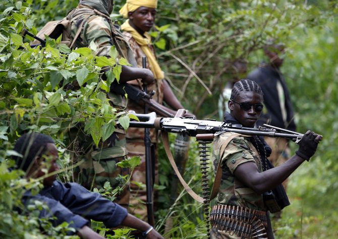 A Seleka fighter holds his machine gun near the town of Kuango, close to the border with Democratic Republic of Congo
