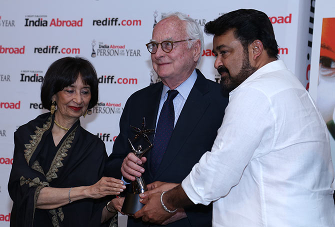 James Ivory receiving the award from noted food writer Madhur Jaffrey and Malayalam actor Mohanlal
