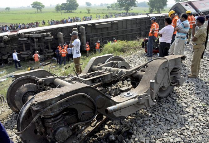 Authorities look on after the Rajdhani Express derailed in Chhapra