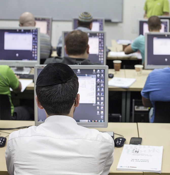 An ultra-orthodox Jewish man attends a computer course at a technical college in Jerusalem