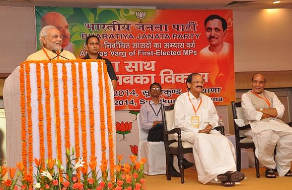 Modi addresses first time MPs at an orientation camp in Surajkund as Union ministers M Venkaiah Naidu and Rajnath Singh look on