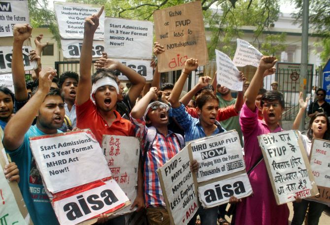 Delhi University students protest demanding scrapping of the four-year course 