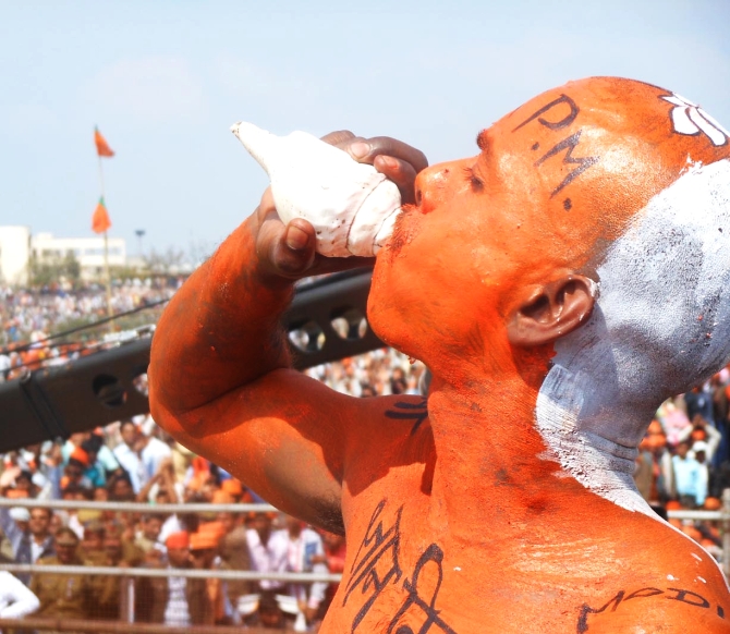 A BJP supporter attends Modi's rally in Lucknow 