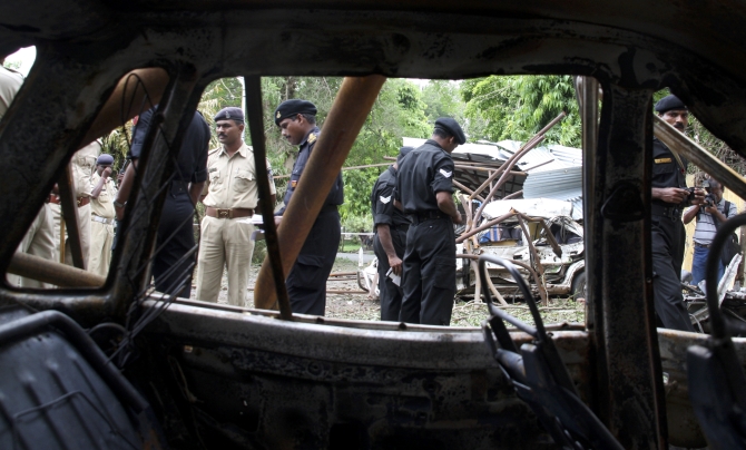 NSG commandos search for evidence at a bomb blast site in Ahmedabad after the July 2008 blasts