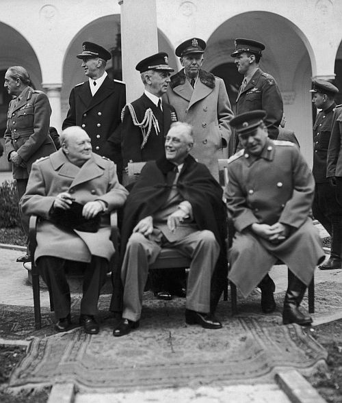 Left to right: British Prime Minister Winston Churchill, US President Franklin Delano Roosevelt and Soviet leader Josef Stalin at the Livadia Palace, Yalta, February 8, 1945. Below: The courtyard of the Livadia Palace.