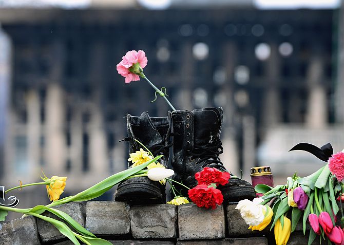 A pair of boots placed as a memorial to an anti-Yanakovych protestor killed in clashes with riot police in Kiev.