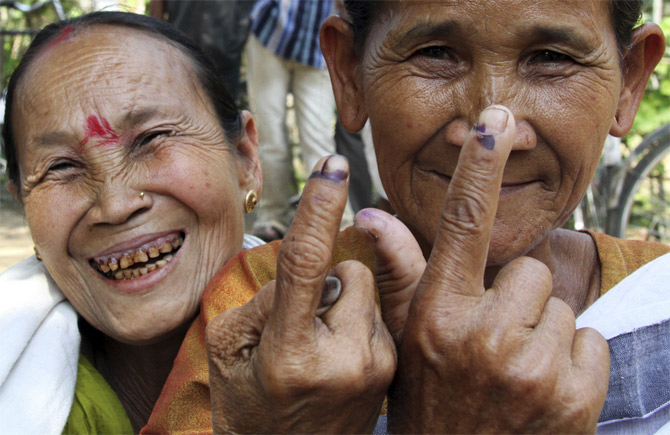 Voters after casting their vote in Khorkhari village, Assam.