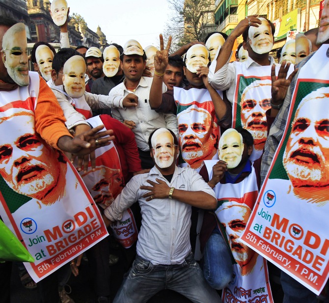 Supporters of the Bharatiya Janata Party's prime ministerial candidate Narendra Modi, as they attend a party campaign rally in Kolkata.