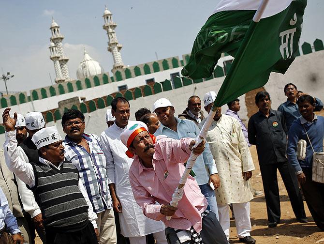 A supporter of Mamata Banerjee cheers on during a rally in New Delhi