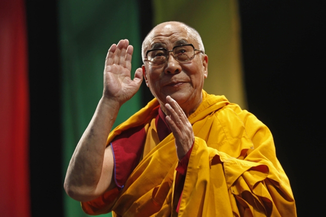 The Dalai Lama greets the audience before his conference: A guide to the way of life of Bodhisattva, in Mexico City.