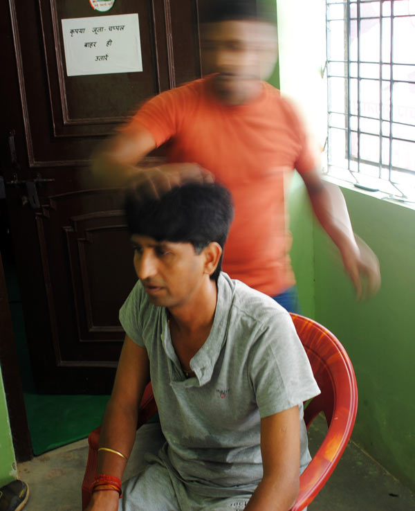 Kumar Vishwas gets a head massage in Amethi.