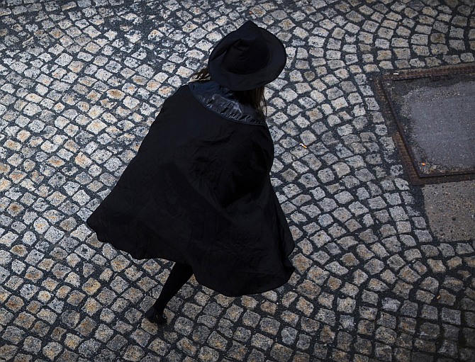  A woman dressed up as a witch walks at the summit of Brocken mountain in the Harz region celebrating the Walpurgisnacht pagan festival