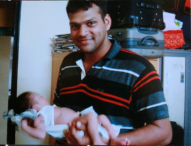 Major Mukund Varadarajan with his baby daughter Arsheya.
