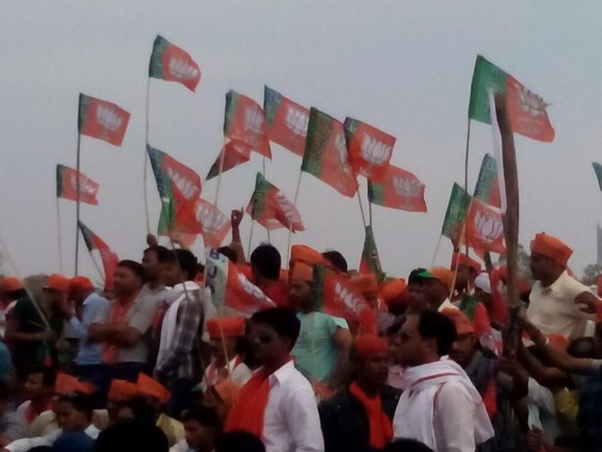 BJP supporters wave flags at Modi's rally in Amethi