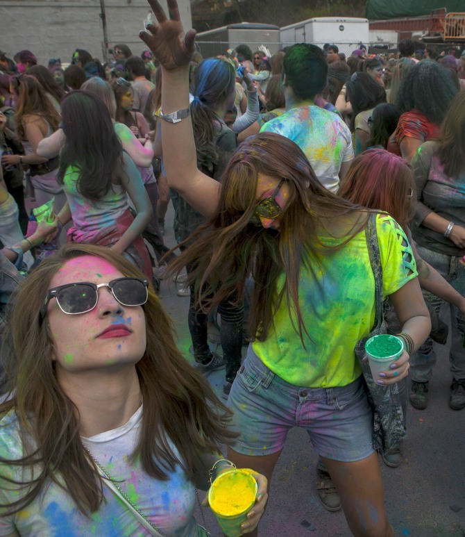 People celebrate Holi on May 3, 2014 in the Brooklyn borough of New York City