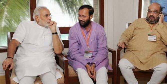 Modi with BJP spokesperson Prakash Javdekar and Amit Shah