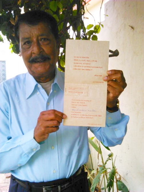 Basil Nathan poses with the wedding invitation that Indira Gandhi sent his mother Victoria in 1968.