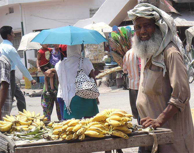A man with a cart of bananas on a Sunday morning in Chhapra.