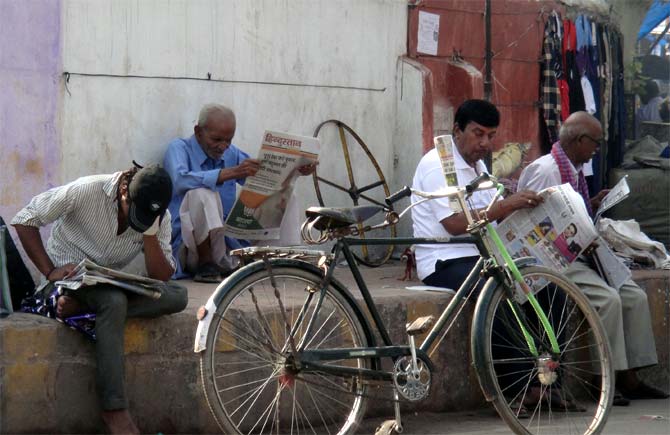 Locals read newspapers at Thana Chowk in Chhapra.