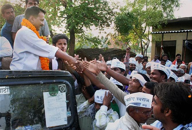 AAP leader Arvind Kejriwal during a roadshow in Varanasi.