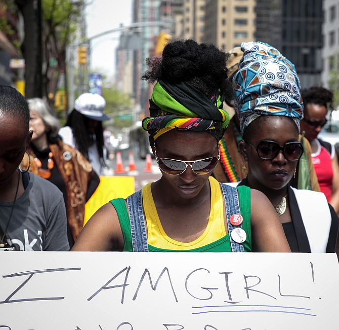 Activists pause during a prayer vigil for abducted Nigerian schoolgirls in front of the Consulate General of Nigeria in Manhattan, New York