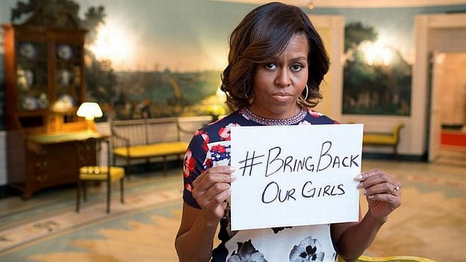 US First Lady Michelle Obama tweeted a picture of herself highlighting the #BringBackOurGirls campaign