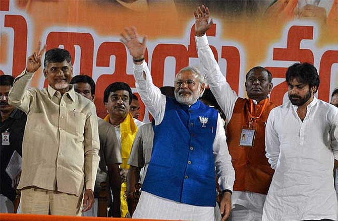 Chandrababu Naidu, Modi and Pawan Kalyan share a dais during a rally