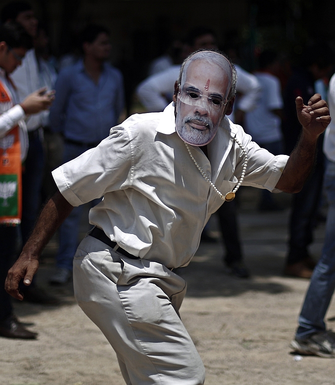 A Modi supporter celebrates in New Delhi 