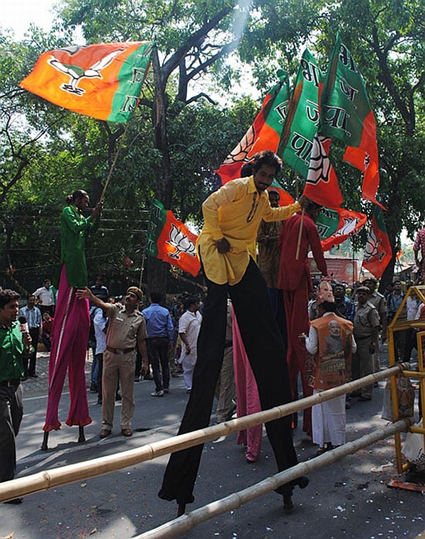 BJP supporters celebrate outside the party HQs in New Delhi