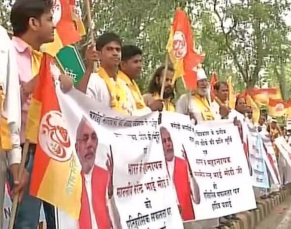 BJP supporters line the streets during Modi's parade 
