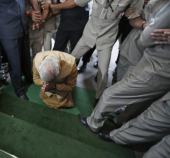 Narendra Damodardas Modi pays obeisance to Parliament, May 22, 2014, ahead of the Bharatiya Janata Party parliamentary meeting, which would elect him as its leader and India's next prime minister. Photograph: Adnan Abidi/Reuters