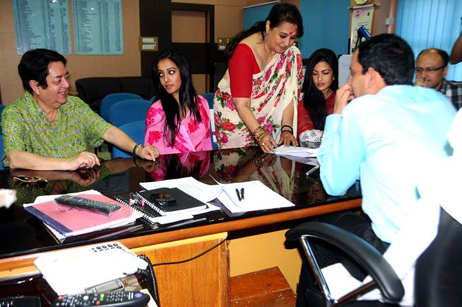 Moon Moon Sen filing her nomination papers in presence of her daughters and her husband.