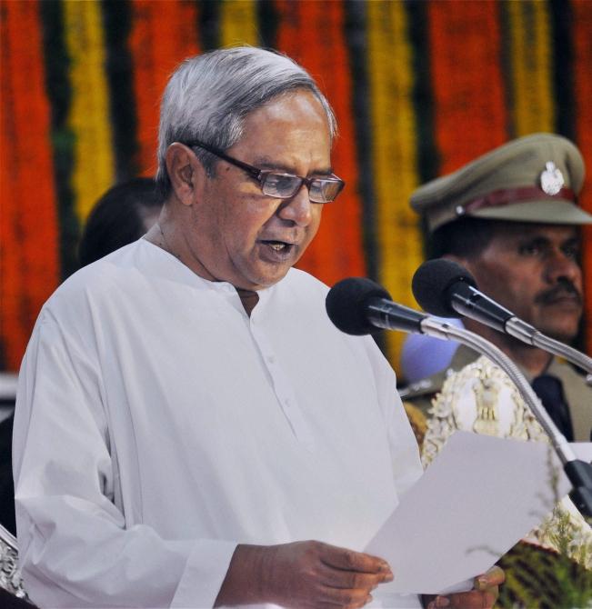 BJD president Naveen Patnaik takes the oath of office and secrecy as the chief minister of Odisha during a ceremony at Raj Bhavan in Bhubaneswar on Wednesday.