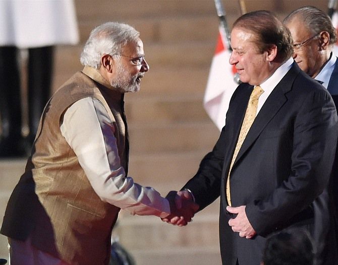 Prime Minister Narendra Modi greets Pakistan Prime Minister Nawaz Sharif at his swearing-in, May 26, 2014.