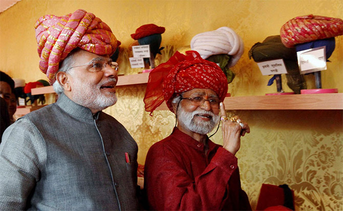 Prime Minister Narendra Modi, left, in a traditional Gujarati turban.