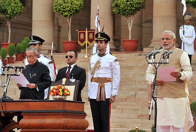 Prime Minister Narendra Modi is administered the oath to office by President Pranab Mukherjee
