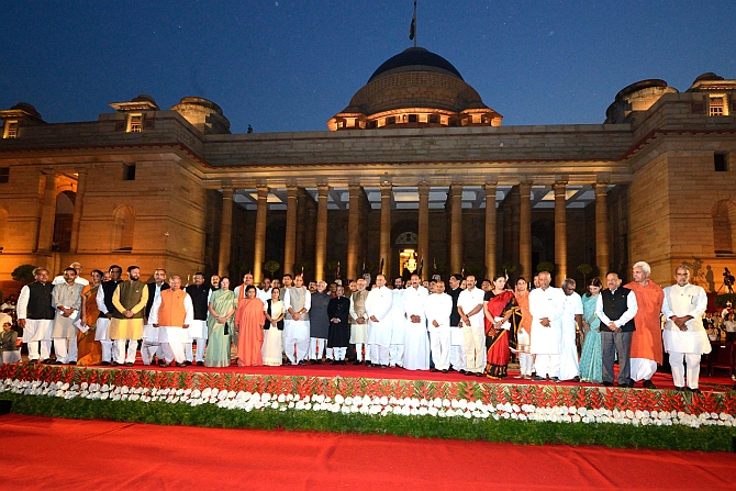Modi and his council of ministers pose for photographs along with President Pranab Mukherjee and Vice President Hamid Ansari at Rashtrapati Bhavan after the oath-taking ceremony