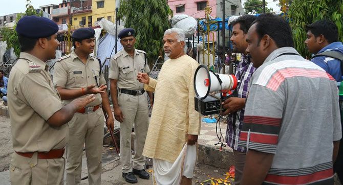 K K Bose is questioned by policemen during his Yatra in Lucknow