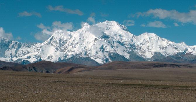 Snow-capped peaks peer down at you on the drive back from the Everest Base Camp