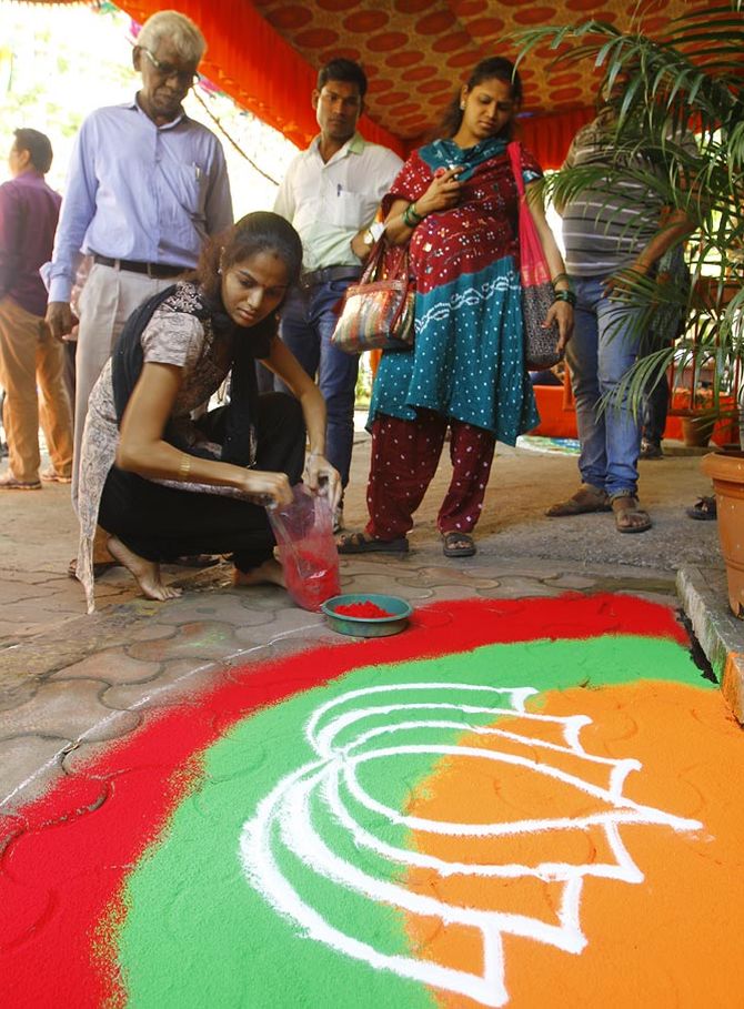 BJP supporters make a rangoli outside the party’s office in Mumbai. Photograph: Hitesh Harisinghani/Rediff.com