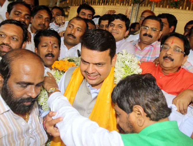Elected BJP MLAs in Maharashtra garland Devendra Fadnavis after his selection as chief minister. Photograph: Sahil Salvi
