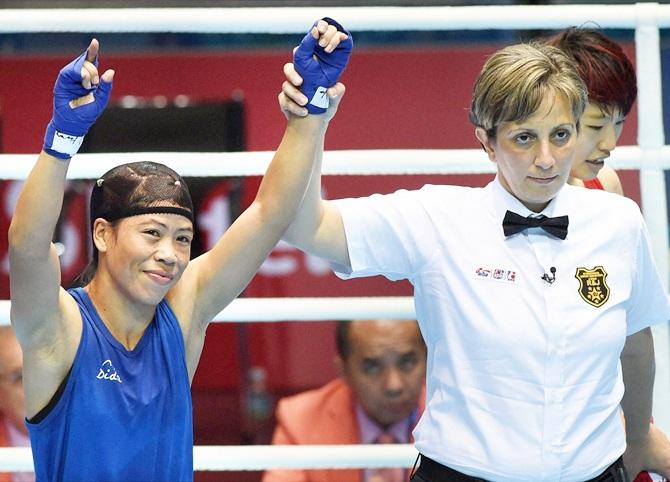 Mary Kom celebrates her victory on Saturday