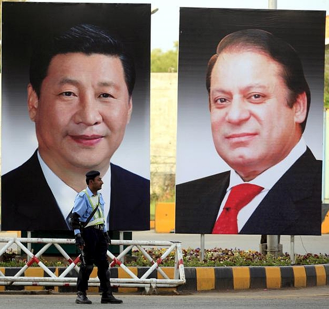 Giant portraits of China's President Xi Jinping and Pakistan's Prime Minister  displayed along a road in Islamabad. Photograph: Faisal Mahmood/Reuters
