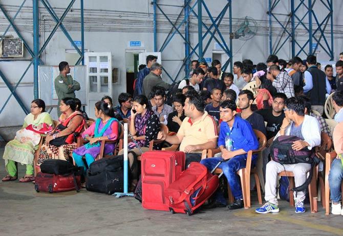 People waiting to be transported at the air base