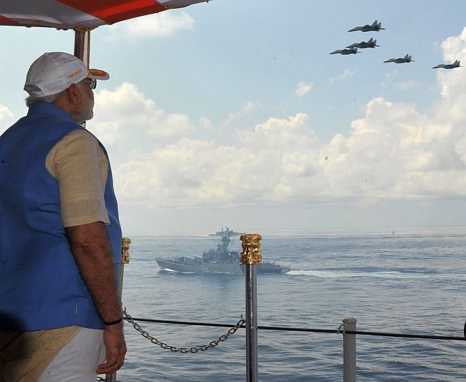 Prime Minister Narendra Modi witnesses an air show aboard the INS Vikramaditya off the Kochi coast, December 15, 2015. Photograph: Press Information Bureau