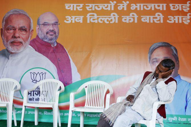 A BJP worker outside the party's campaign office