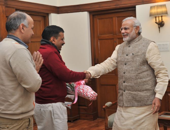 Arvind Kejriwal and Manish Sisodia greet Prime Minister Narendra Modi.