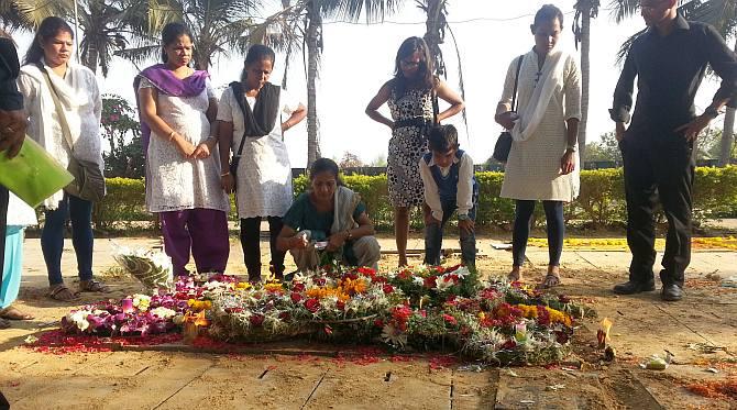 From right: Kevin, Wilma, Rhys, along with relatives maintaining silence in memory of Russel